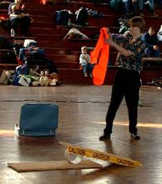 Eric Tate puts on a safety vest for juggling