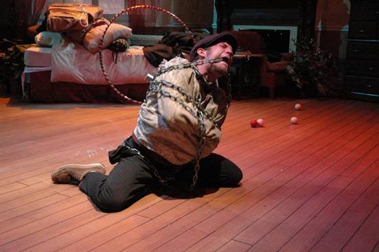 Jeff struggles to escape the chains and straitjacket.