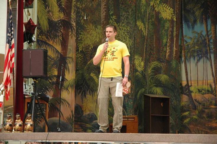 Dan Howard emcees the juggling competition.