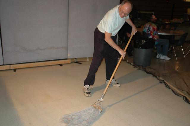 Dave Altman mops the floor for the bounce cage.